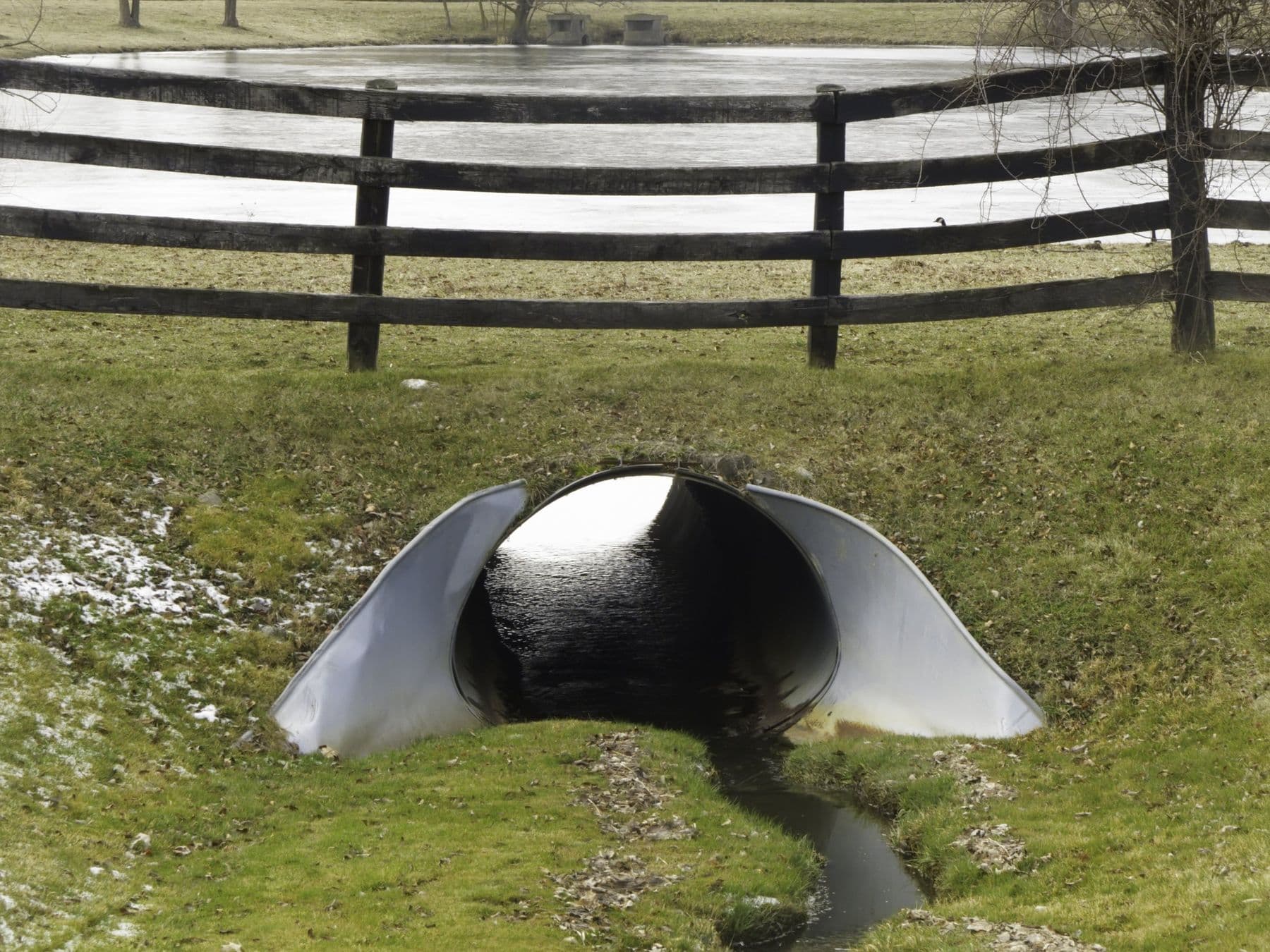 Stock pond excavation with culvert overflow in East Texas